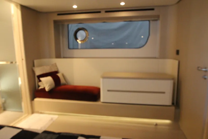 Slide: The Image of Luxurious interior of 2023 Azimut Fly 68 yacht with elegant seating and window view. - 67