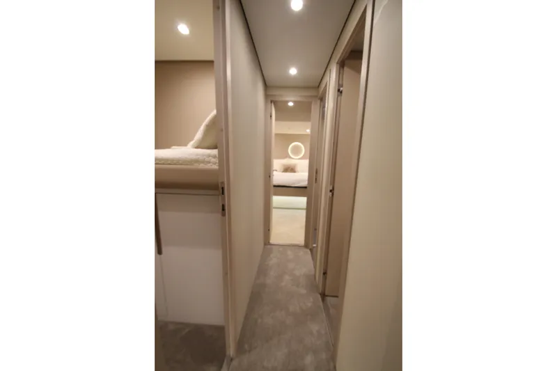 Slide: The Image of Luxurious interior hallway of 2023 Azimut Fly 68 yacht, featuring modern design and ambient lighting. - 35