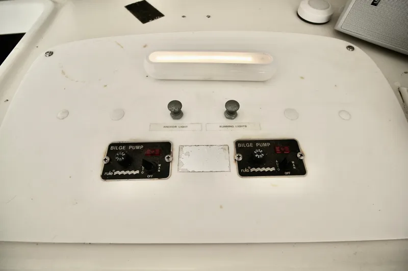 Slide: The Image of Control panel of a 1970 Bertram 31 Sportfisher with bilge pump switches. - 14