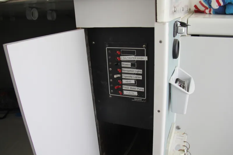 Slide: The Image of Electrical panel on a 1970 Bertram 31 Sportfisher boat with labeled switches. - 19
