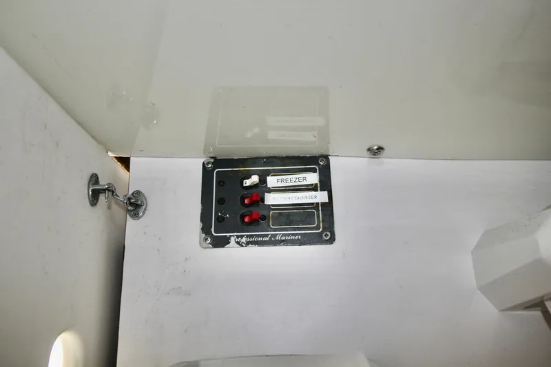 Slide: The Image of Electrical panel on a 1970 Bertram 31 Sportfisher boat, featuring labeled switches. - 20