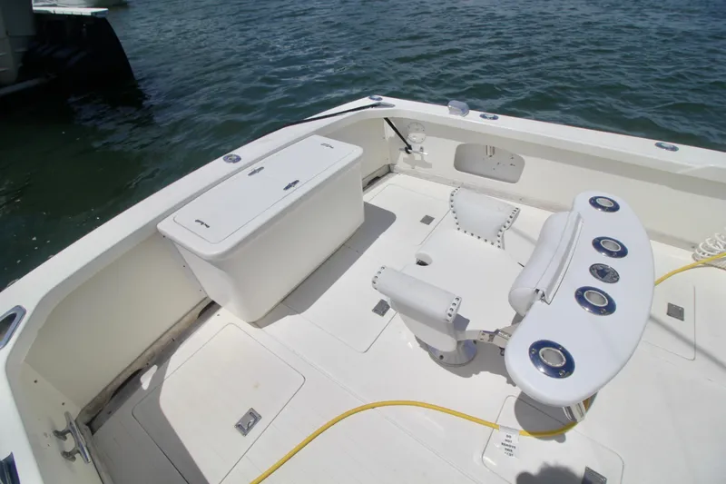 Slide: The Image of 1970 Bertram 31 Sportfisher boat deck with fishing chair and storage compartment. - 22