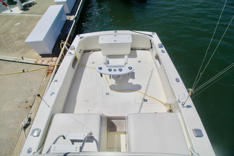 Slide: The Image of 1970 Bertram 31 Sportfisher boat deck, docked at marina, aerial view. - 23