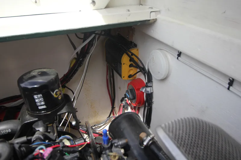 Slide: The Image of Engine compartment of a 1970 Bertram 31 Sportfisher with wiring and components visible. - 26