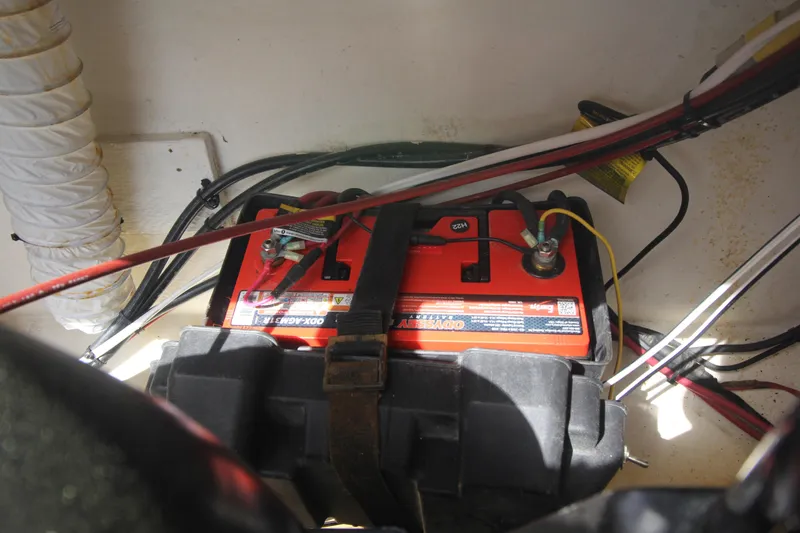 Slide: The Image of Battery compartment of a 1970 Bertram 31 Sportfisher boat with wiring and connections. - 27