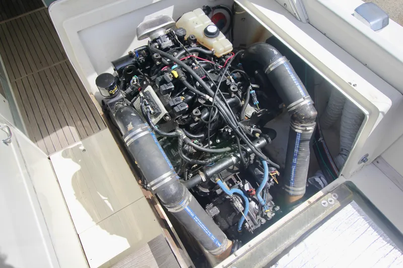 Slide: The Image of Engine compartment of a 1970 Bertram 31 Sportfisher boat, showcasing detailed mechanics. - 28