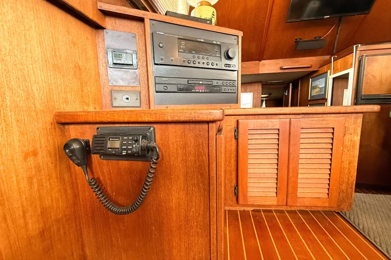 Slide: The Image of 1986 Viking 35 Convertible interior with wooden cabinetry and communication equipment. - 11
