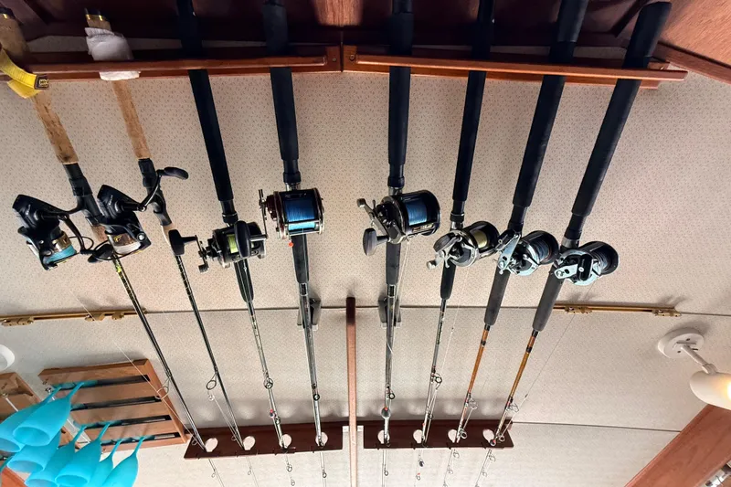 Slide: The Image of Fishing rods stored on a 1986 Viking 35 Convertible boat ceiling rack. - 16