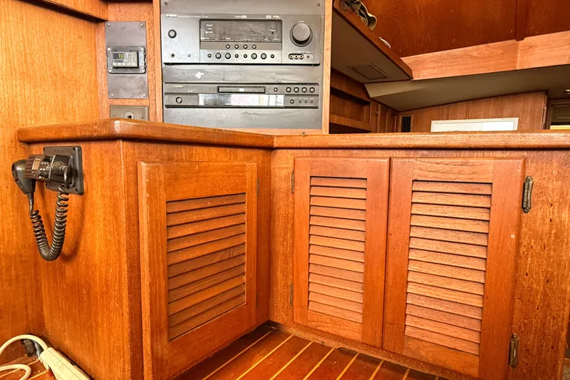 Slide: The Image of 1986 Viking 35 Convertible interior with wooden cabinetry and built-in audio system. - 17