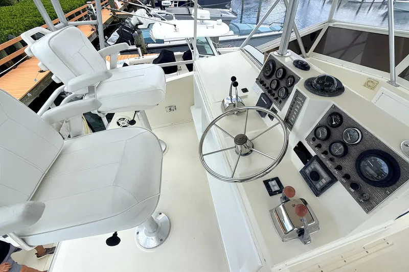Slide: The Image of Helm of 1986 Viking 35 Convertible boat with steering wheel and control panel. - 22