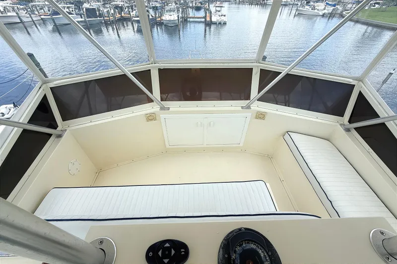 Slide: The Image of Flybridge view of 1986 Viking 35 Convertible yacht, overlooking marina. - 27