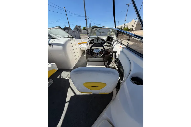 Slide: The Image of 2007 Regal 2400 Bowrider interior with steering wheel and dashboard view. - 11