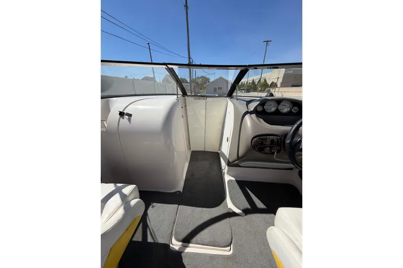 Slide: The Image of Interior view of a 2007 Regal 2400 Bowrider boat cockpit with steering wheel and dashboard. - 17
