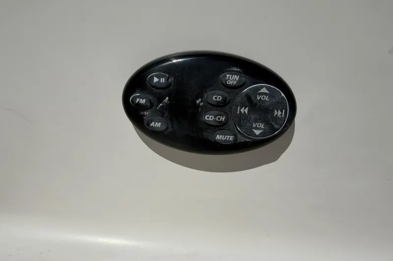 Slide: The Image of Audio control panel on a 2007 Regal 2400 Bowrider boat dashboard. - 24