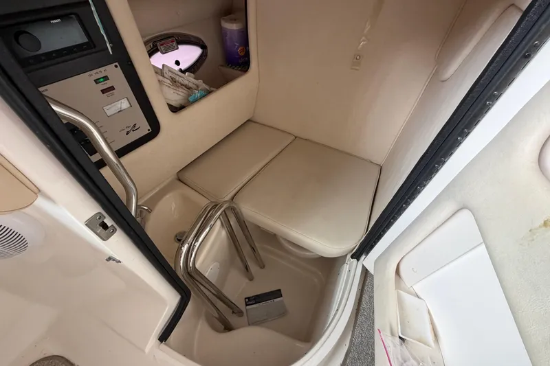 Slide: The Image of Interior cabin of 2003 Sea Ray 290 Bowrider boat with seating and control panel. - 17