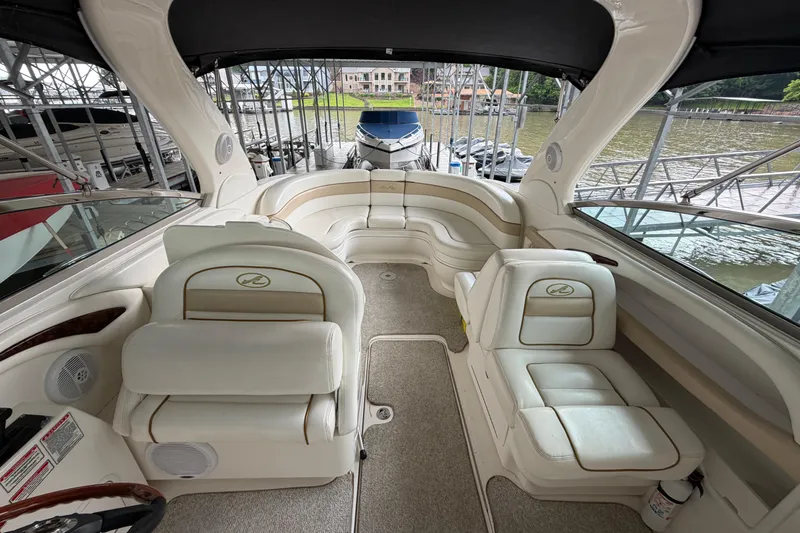 Slide: The Image of 2003 Sea Ray 290 Bowrider interior with plush seating and elegant design. - 26