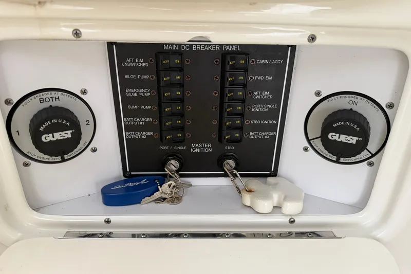 Slide: The Image of Control panel of a 2003 Sea Ray 290 Bowrider boat with ignition keys. - 28