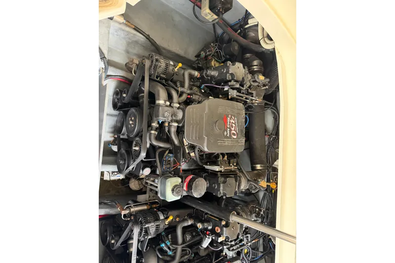Slide: The Image of Engine compartment of a 2003 Sea Ray 290 Bowrider boat, showcasing mechanical components. - 30