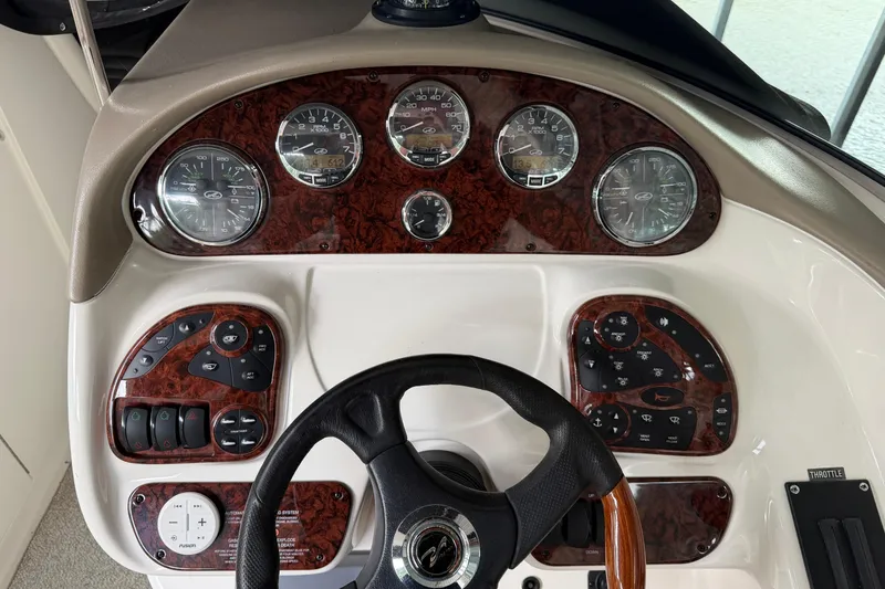 Slide: The Image of Dashboard of a 2003 Sea Ray 290 Bowrider boat with gauges and controls. - 6