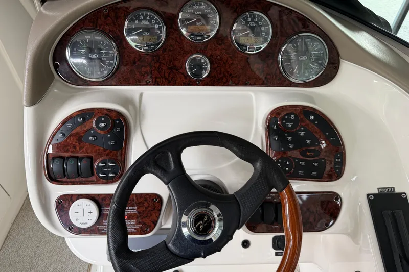 Slide: The Image of Dashboard of a 2003 Sea Ray 290 Bowrider with gauges and controls. - 9