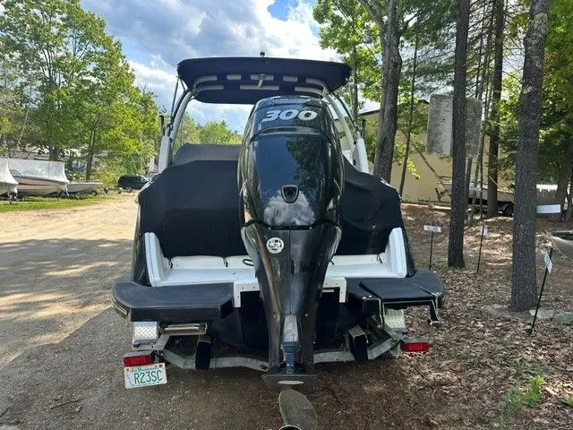 Slide: The Image of Rear view of a 2018 Cobalt 23 SC boat with outboard motor. - 3
