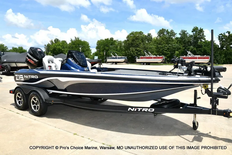 The Image of 2018 Nitro Z19 Pro boat on trailer, blue sky. - 1