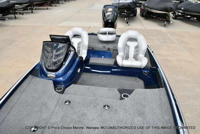 Slide: The Image of 2018 Nitro Z19 Pro boat with gray seats and blue deck. - 12