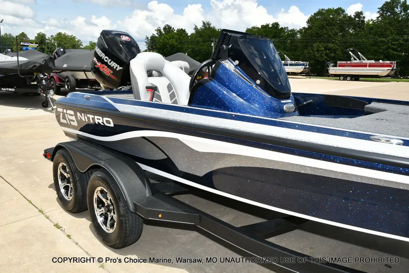 Slide: The Image of 2018 Nitro Z19 Pro boat on trailer, blue and white design. - 17