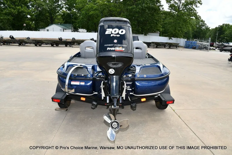Slide: The Image of Rear view of a blue 2018 Nitro Z19 Pro boat on a trailer. - 28