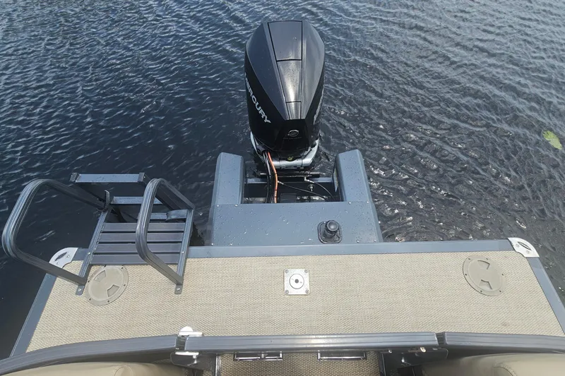 Slide: The Image of 2020 Regency 230 LE3 boat with Mercury outboard motor on water. - 30