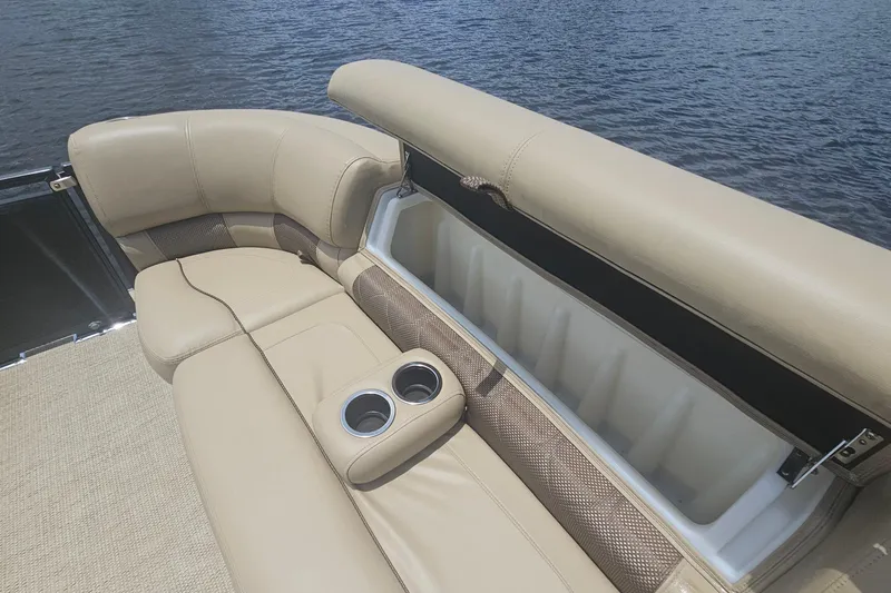 Slide: The Image of Luxurious seating on 2020 Regency 230 LE3 boat with storage and cup holders. - 43