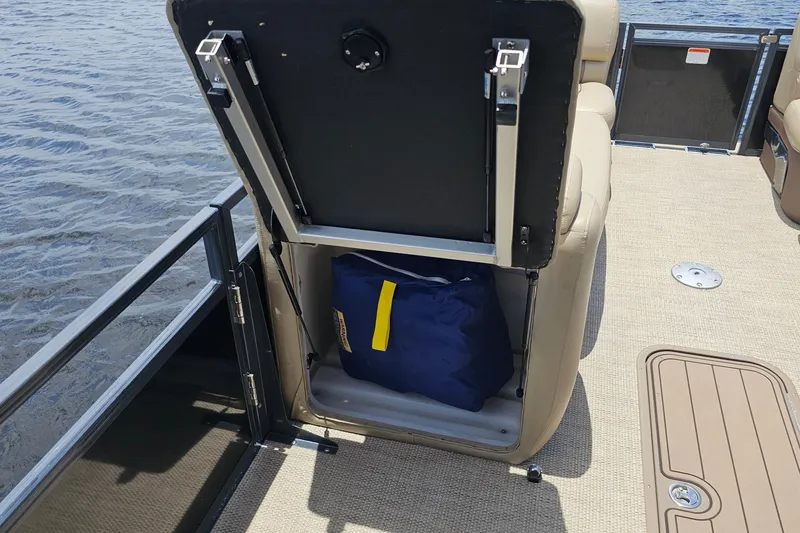 Slide: The Image of Storage compartment on a 2020 Regency 230 LE3 pontoon boat, open to reveal contents. - 51