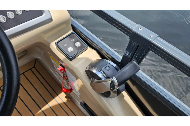Slide: The Image of Control panel of 2020 Regency 230 LE3 boat with throttle and safety features. - 54