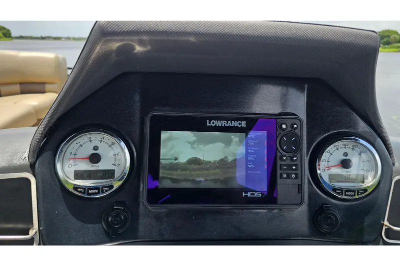 Slide: The Image of Dashboard of 2020 Regency 230 LE3 boat with Lowrance HDS7 display and gauges. - 58