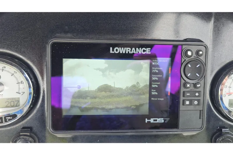 Slide: The Image of Lowrance HDS7 display on 2020 Regency 230 LE3 boat dashboard, showing video settings and gauges. - 59