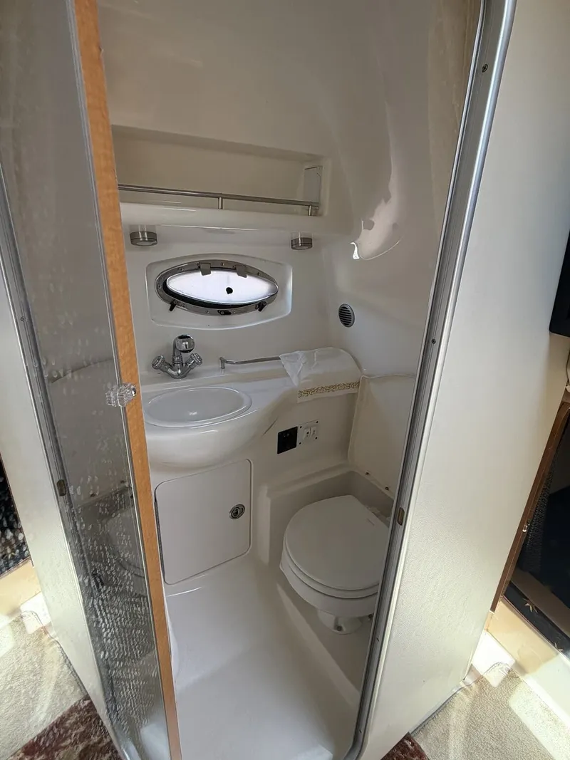 Slide: The Image of Interior of a 2006 Chaparral Signature yacht with bathroom and sink. - 12