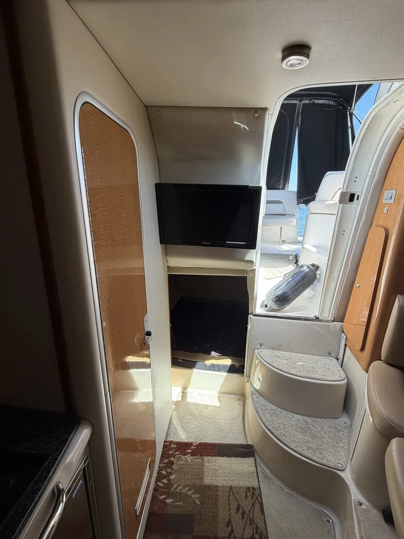 Slide: The Image of Interior of a 2006 Chaparral Signature yacht with TV and stairs. - 13