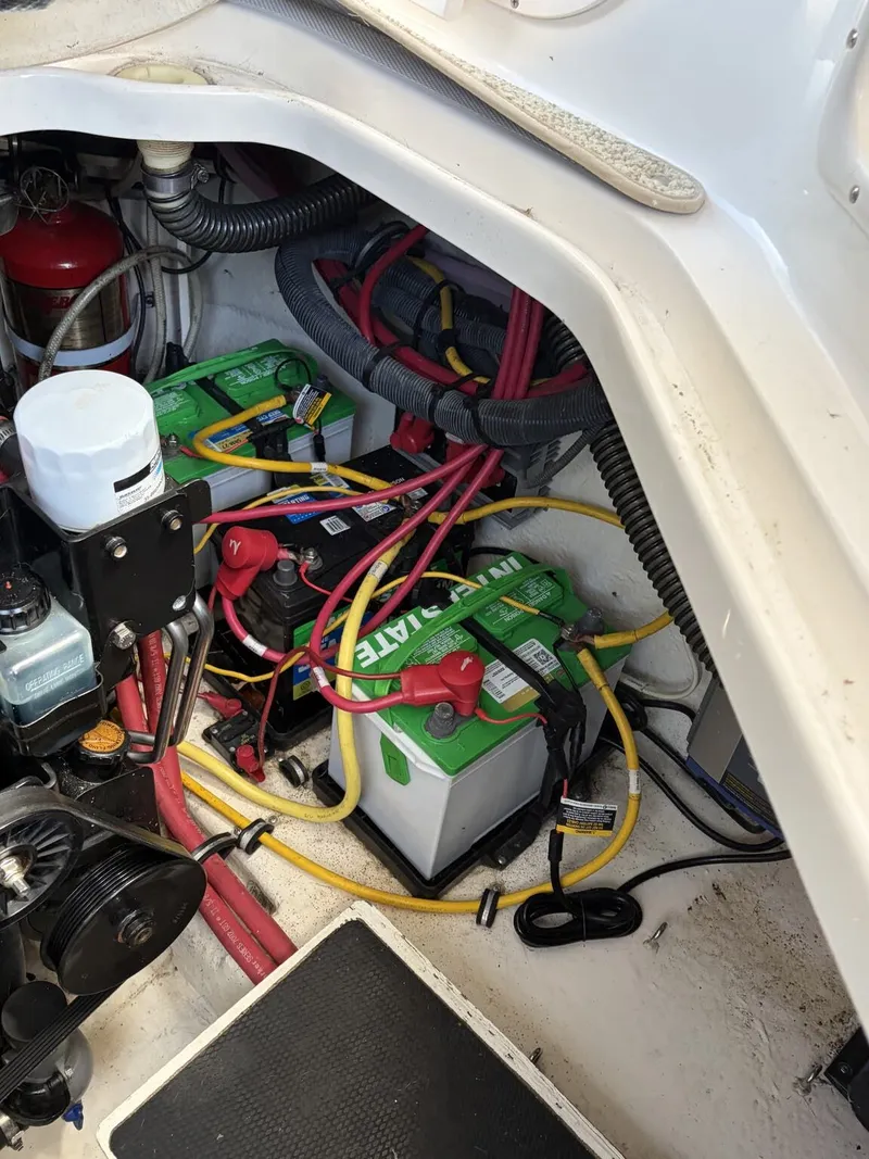 Slide: The Image of Battery compartment of a 2006 Chaparral Signature boat with cables. - 19