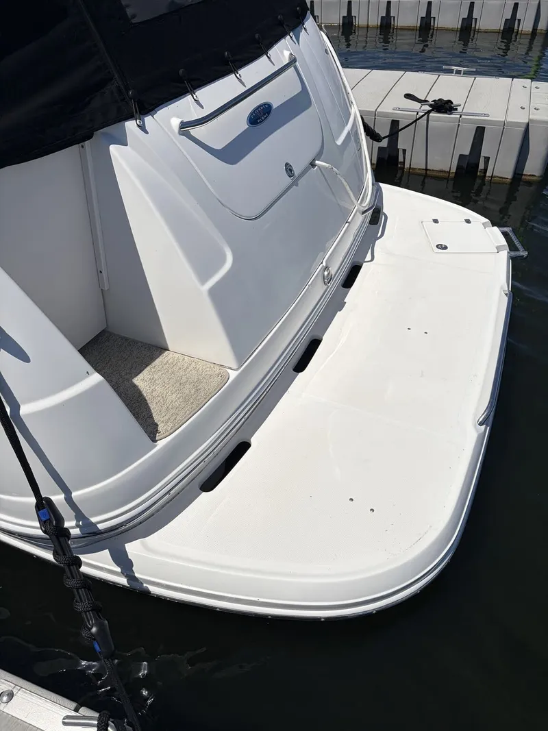 Slide: The Image of Rear view of a 2006 Chaparral Signature boat at dock. - 4
