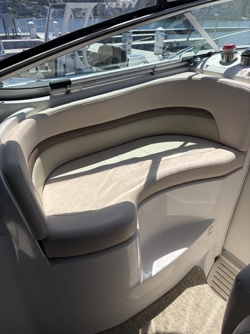 Slide: The Image of Interior of a 2006 Chaparral Signature yacht with curved seating area. - 6