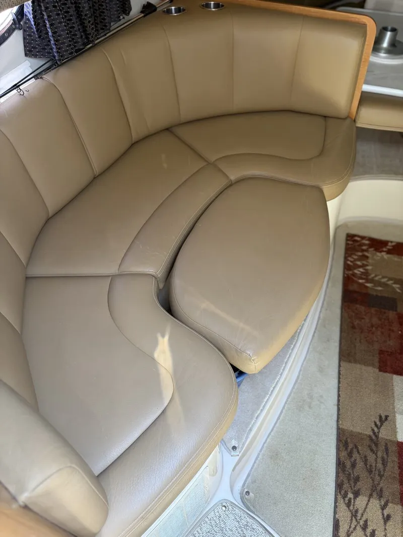 Slide: The Image of Interior of a 2006 Chaparral Signature with beige leather sofa. - 8