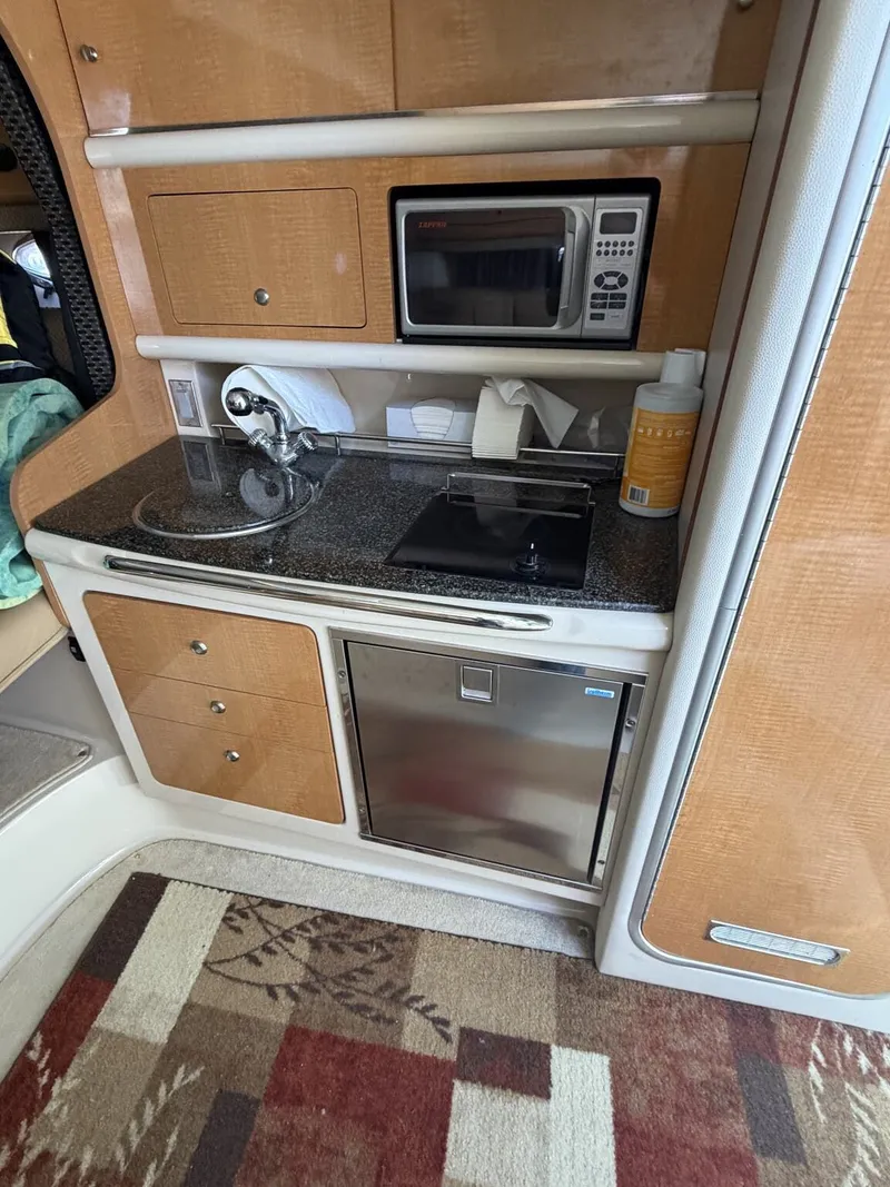 Slide: The Image of Interior of 2006 Chaparral Signature with kitchenette and microwave. - 9