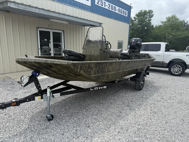 Slide: The Image of 2026 Lowe Roughneck Center Console boat on trailer outside building. - 5