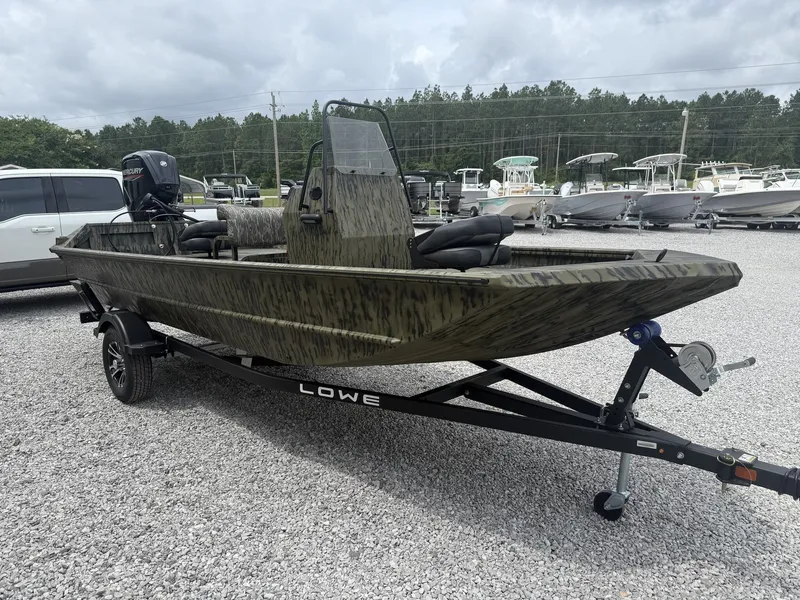 Slide: The Image of 2026 Lowe Roughneck Center Console 1760 Pathfinder on trailer, parked outdoors. - 6