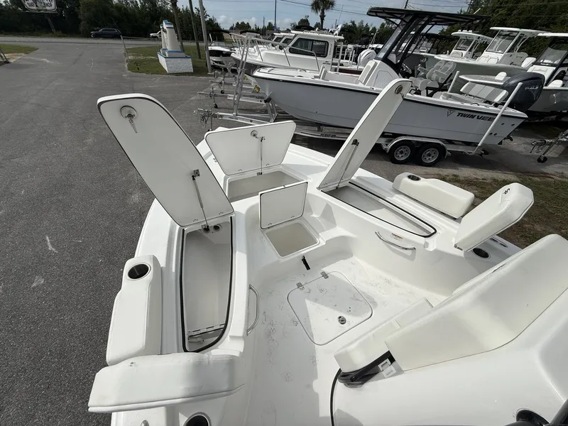 Slide: The Image of Sea Pro 230 Bay boat with open storage compartments, year 2026. - 7
