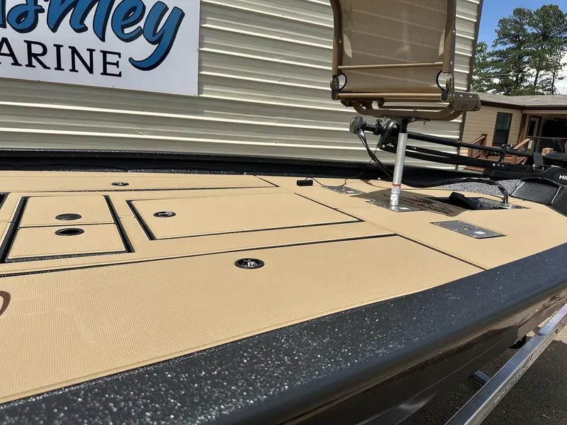 Slide: The Image of 2026 Xpress H20C Crappie boat deck with storage and seat. - 6