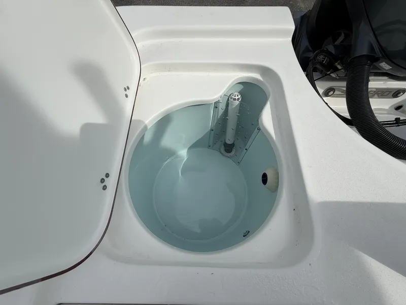 Slide: The Image of Sea Pro 230 Bay 2026 with Yamaha 200, open storage compartment. - 9