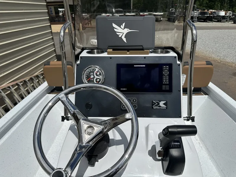Slide: The Image of 2026 Xpress Xclusive XR 21 Bay boat console with controls. - 10