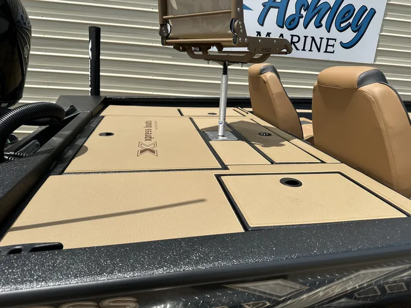 Slide: The Image of 2026 Xpress H20C Crappie boat with beige deck and seats. - 8