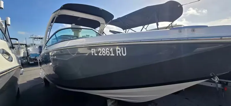 Slide: The Image of 2019 Regal 23 OBX boat with Florida registration in harbor. - 1
